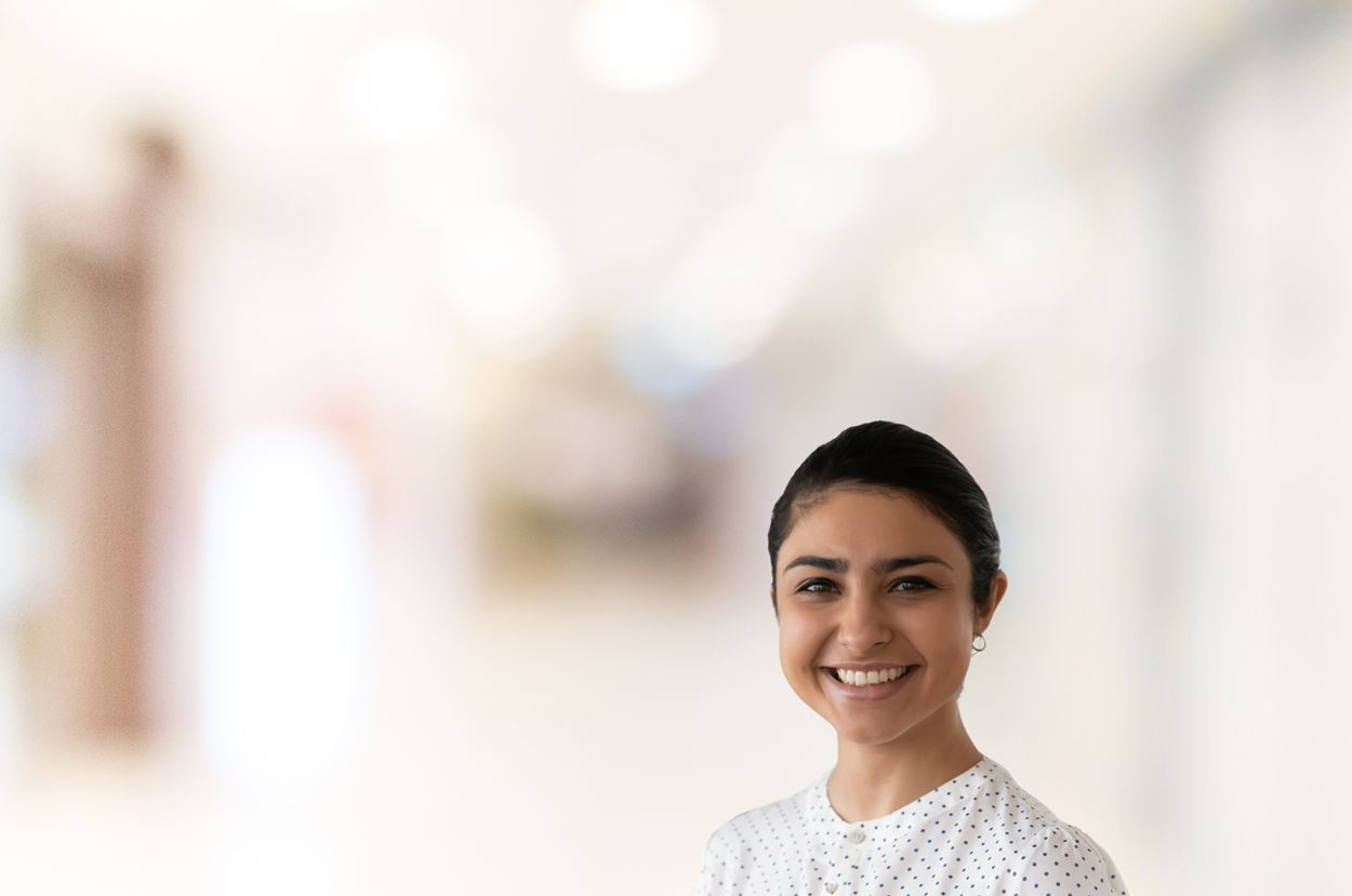 Woman smiling, blurred background